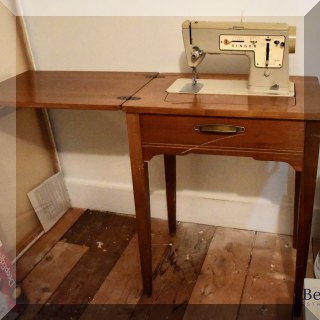 F51. Singer Stylist sewing machine with sewing cabinet.  30”h x 24”L X 18”d - $75